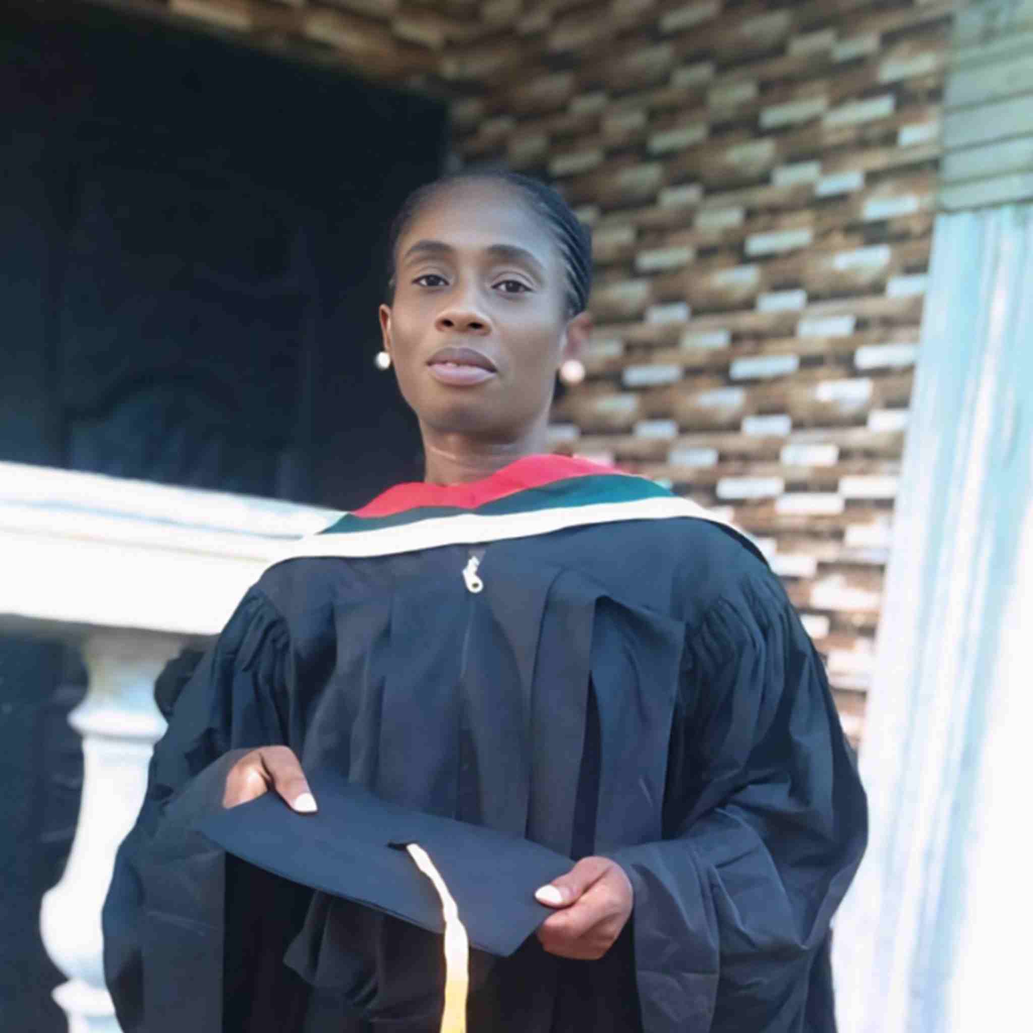 Headshot of Rev. Victoria N. Floh, Field Coordinator, in graduation gown.